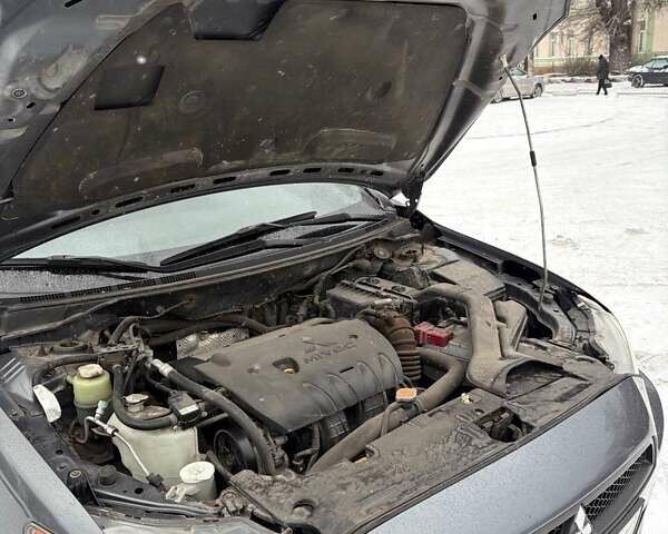 Серый Мицубиси Лансер, объемом двигателя 2 л и пробегом 187 тыс. км за 7000 $, фото 13 на Automoto.ua