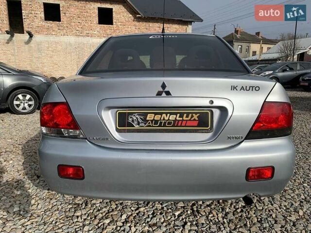Серый Мицубиси Лансер, объемом двигателя 1.58 л и пробегом 227 тыс. км за 3599 $, фото 4 на Automoto.ua