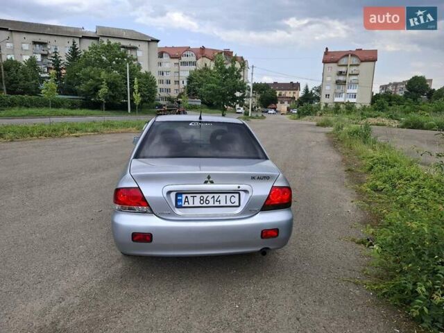 Серый Мицубиси Лансер, объемом двигателя 1.6 л и пробегом 210 тыс. км за 4123 $, фото 2 на Automoto.ua