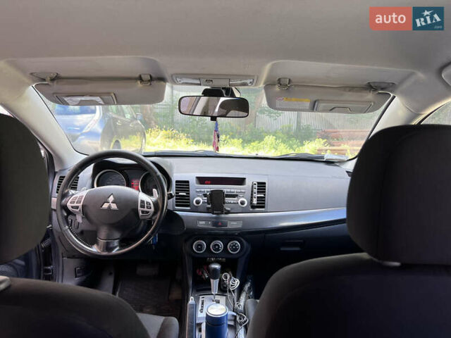 Серый Мицубиси Лансер, объемом двигателя 2 л и пробегом 222 тыс. км за 6999 $, фото 5 на Automoto.ua