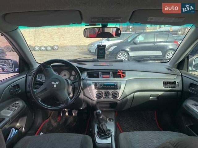 Серый Мицубиси Лансер, объемом двигателя 1.58 л и пробегом 227 тыс. км за 3599 $, фото 18 на Automoto.ua