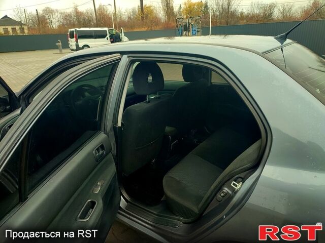 Сірий Міцубісі Lancer, об'ємом двигуна 1.6 л та пробігом 197 тис. км за 3600 $, фото 6 на Automoto.ua