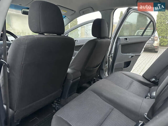 Серый Мицубиси Лансер, объемом двигателя 2 л и пробегом 279 тыс. км за 4999 $, фото 19 на Automoto.ua