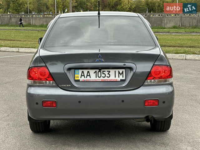 Сірий Міцубісі Lancer, об'ємом двигуна 1.58 л та пробігом 94 тис. км за 6500 $, фото 1 на Automoto.ua