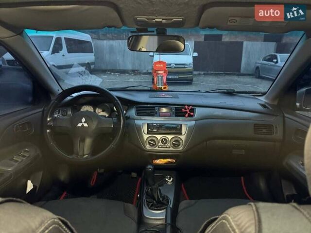 Серый Мицубиси Лансер, объемом двигателя 1.58 л и пробегом 227 тыс. км за 3200 $, фото 7 на Automoto.ua