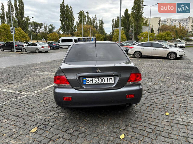 Серый Мицубиси Лансер, объемом двигателя 1.6 л и пробегом 218 тыс. км за 5100 $, фото 5 на Automoto.ua