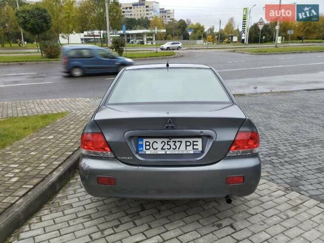 Сірий Міцубісі Lancer, об'ємом двигуна 1.58 л та пробігом 209 тис. км за 2900 $, фото 9 на Automoto.ua