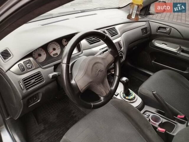 Сірий Міцубісі Lancer, об'ємом двигуна 1.58 л та пробігом 209 тис. км за 2900 $, фото 14 на Automoto.ua