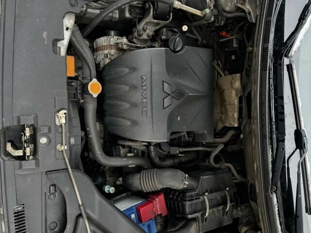 Серый Мицубиси Лансер, объемом двигателя 1.5 л и пробегом 170 тыс. км за 9000 $, фото 3 на Automoto.ua