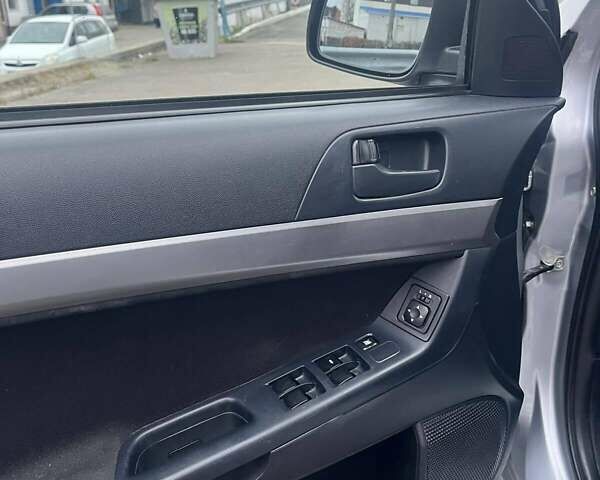 Серый Мицубиси Лансер, объемом двигателя 1.5 л и пробегом 190 тыс. км за 5800 $, фото 7 на Automoto.ua