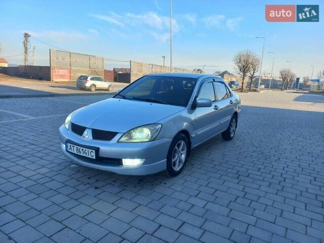 Серый Мицубиси Лансер, объемом двигателя 1.6 л и пробегом 228 тыс. км за 2999 $, фото 2 на Automoto.ua