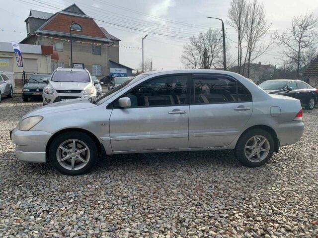 Серый Мицубиси Лансер, объемом двигателя 1.6 л и пробегом 227 тыс. км за 3599 $, фото 6 на Automoto.ua