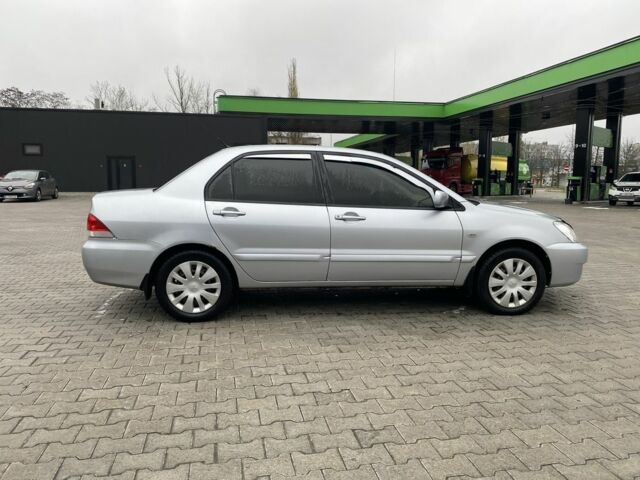 Сірий Міцубісі Lancer, об'ємом двигуна 1.6 л та пробігом 240 тис. км за 4650 $, фото 8 на Automoto.ua