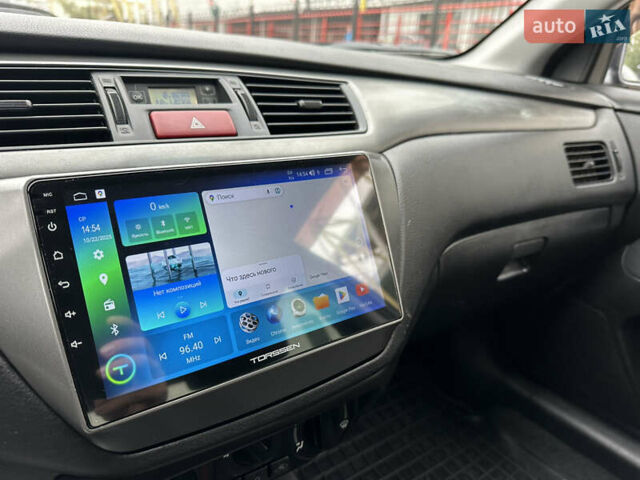 Мицубиси Лансер 2009 в Киеве на Automoto.ua Серый Мицубиси Лансер, объемом двигателя 1.58 л и пробегом 94 тыс. км за 5990 $, фото 29 на Automoto.ua