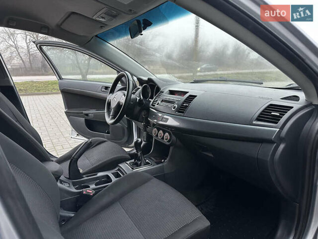 Серый Мицубиси Лансер, объемом двигателя 2 л и пробегом 279 тыс. км за 4999 $, фото 22 на Automoto.ua