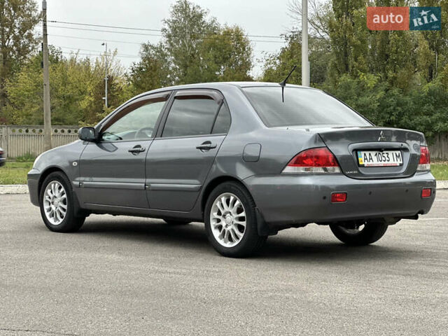 Сірий Міцубісі Lancer, об'ємом двигуна 1.58 л та пробігом 94 тис. км за 6500 $, фото 6 на Automoto.ua