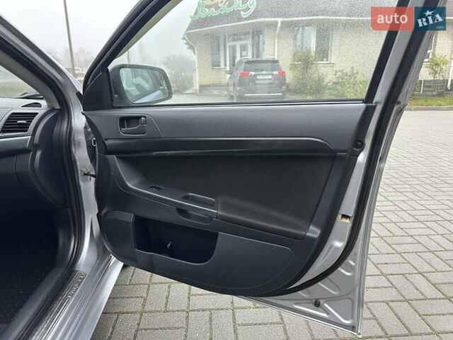 Серый Мицубиси Лансер, объемом двигателя 2 л и пробегом 279 тыс. км за 4999 $, фото 21 на Automoto.ua