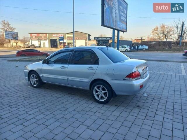 Серый Мицубиси Лансер, объемом двигателя 1.6 л и пробегом 228 тыс. км за 2999 $, фото 18 на Automoto.ua