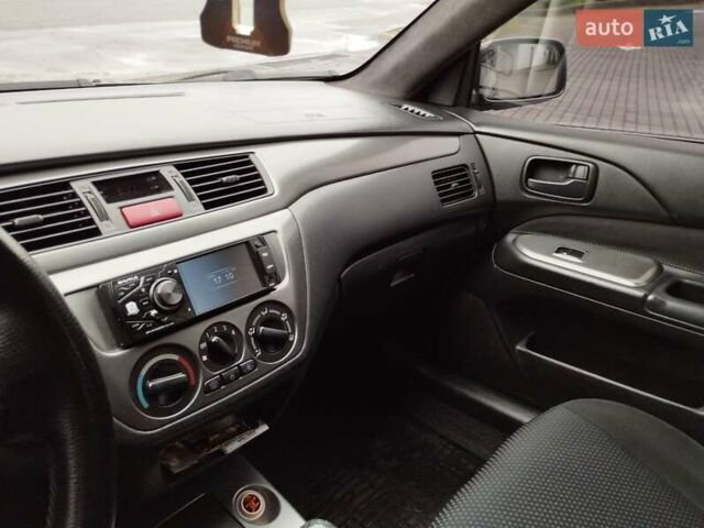 Сірий Міцубісі Lancer, об'ємом двигуна 1.58 л та пробігом 209 тис. км за 2900 $, фото 17 на Automoto.ua