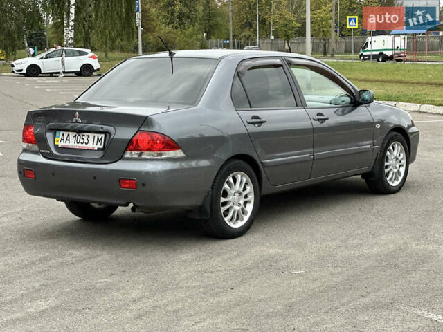 Сірий Міцубісі Lancer, об'ємом двигуна 1.58 л та пробігом 94 тис. км за 6500 $, фото 2 на Automoto.ua
