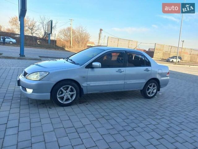 Серый Мицубиси Лансер, объемом двигателя 1.6 л и пробегом 228 тыс. км за 2999 $, фото 21 на Automoto.ua