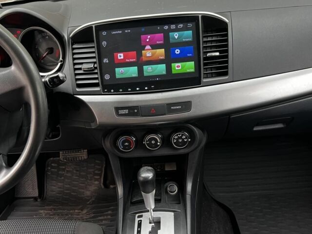 Серый Мицубиси Лансер, объемом двигателя 1.5 л и пробегом 170 тыс. км за 9000 $, фото 2 на Automoto.ua