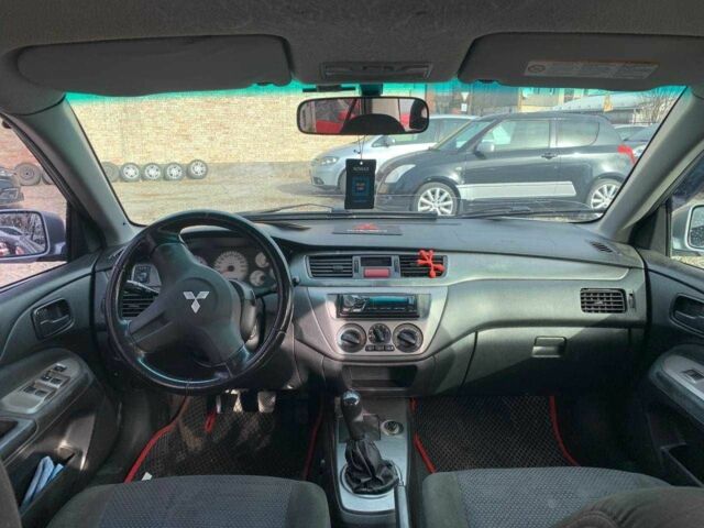 Серый Мицубиси Лансер, объемом двигателя 1.6 л и пробегом 227 тыс. км за 3599 $, фото 18 на Automoto.ua