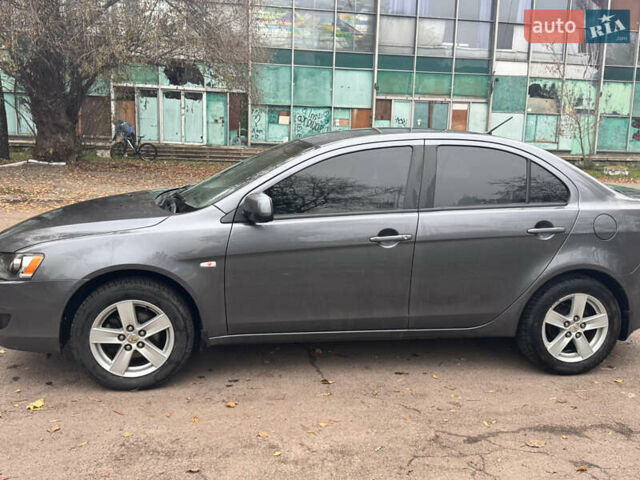Серый Мицубиси Лансер, объемом двигателя 1.5 л и пробегом 116 тыс. км за 6000 $, фото 3 на Automoto.ua
