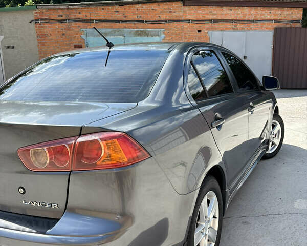 Сірий Міцубісі Lancer, об'ємом двигуна 2 л та пробігом 194 тис. км за 6900 $, фото 6 на Automoto.ua
