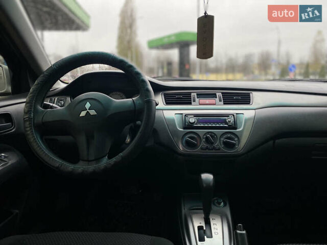 Сірий Міцубісі Lancer, об'ємом двигуна 1.58 л та пробігом 280 тис. км за 4650 $, фото 12 на Automoto.ua