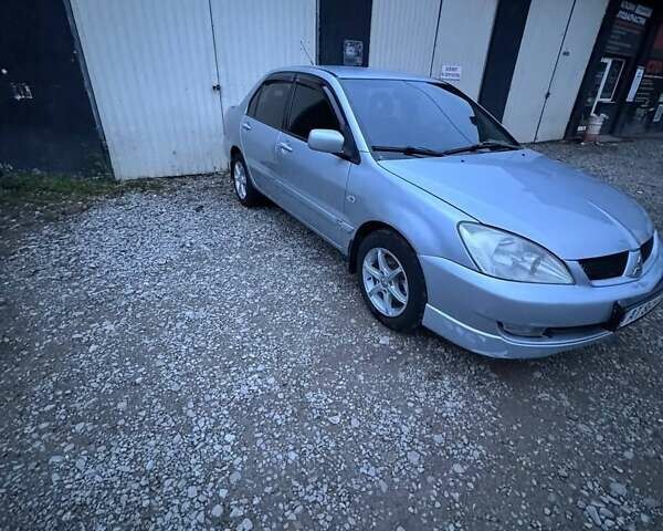 Серый Мицубиси Лансер, объемом двигателя 1.58 л и пробегом 227 тыс. км за 3200 $, фото 3 на Automoto.ua