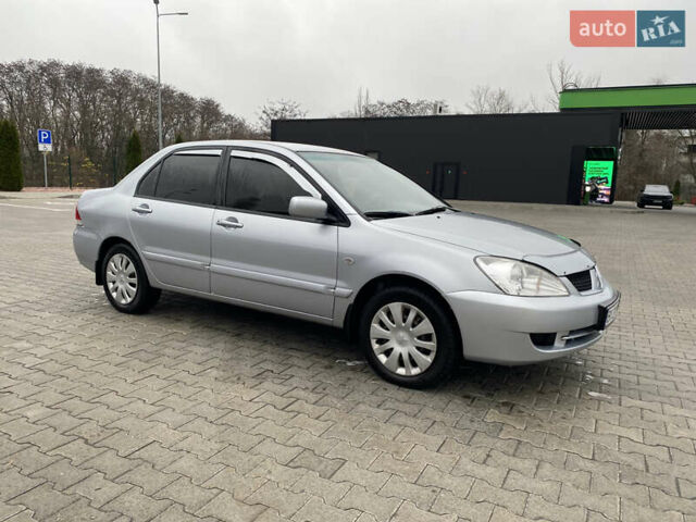 Сірий Міцубісі Lancer, об'ємом двигуна 1.58 л та пробігом 280 тис. км за 4650 $, фото 8 на Automoto.ua