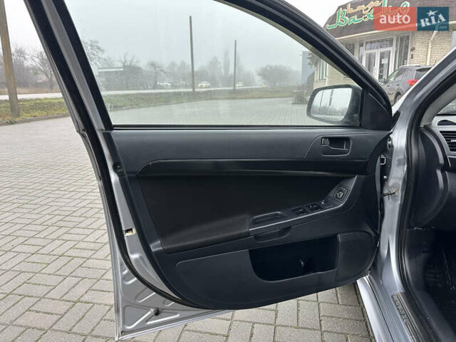 Серый Мицубиси Лансер, объемом двигателя 2 л и пробегом 279 тыс. км за 4999 $, фото 12 на Automoto.ua