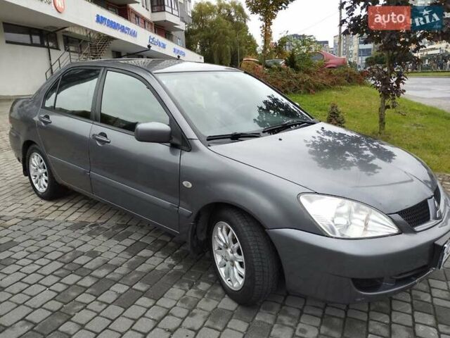 Сірий Міцубісі Lancer, об'ємом двигуна 1.58 л та пробігом 209 тис. км за 2900 $, фото 13 на Automoto.ua