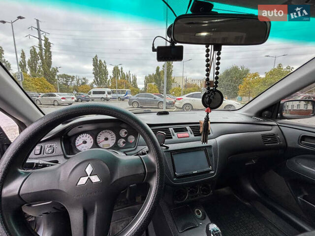 Серый Мицубиси Лансер, объемом двигателя 1.6 л и пробегом 218 тыс. км за 5100 $, фото 20 на Automoto.ua