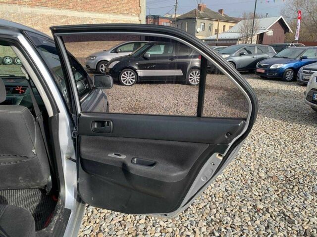 Серый Мицубиси Лансер, объемом двигателя 1.6 л и пробегом 227 тыс. км за 3599 $, фото 10 на Automoto.ua