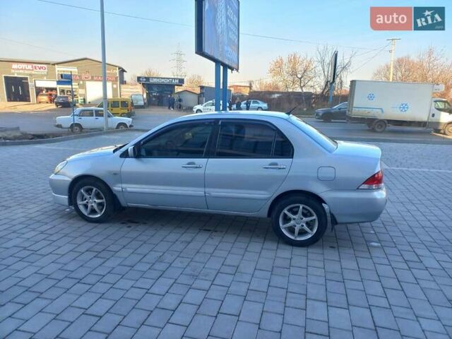 Серый Мицубиси Лансер, объемом двигателя 1.58 л и пробегом 228 тыс. км за 3600 $, фото 10 на Automoto.ua