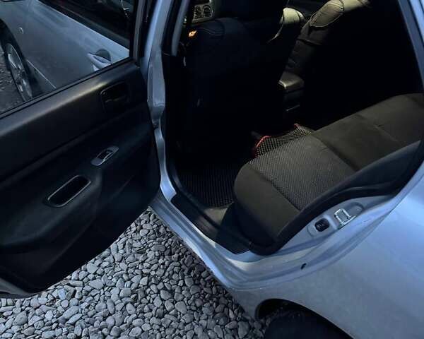 Серый Мицубиси Лансер, объемом двигателя 1.58 л и пробегом 227 тыс. км за 3200 $, фото 9 на Automoto.ua