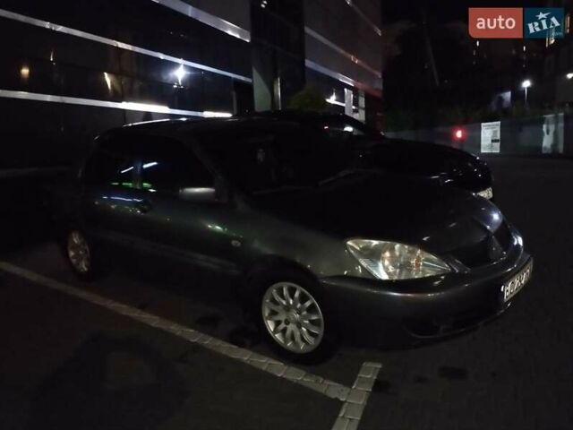 Сірий Міцубісі Lancer, об'ємом двигуна 1.58 л та пробігом 209 тис. км за 2900 $, фото 1 на Automoto.ua