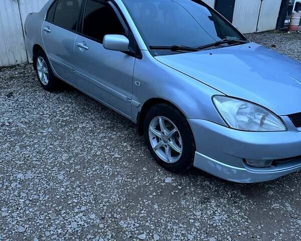 Серый Мицубиси Лансер, объемом двигателя 1.58 л и пробегом 227 тыс. км за 3200 $, фото 1 на Automoto.ua