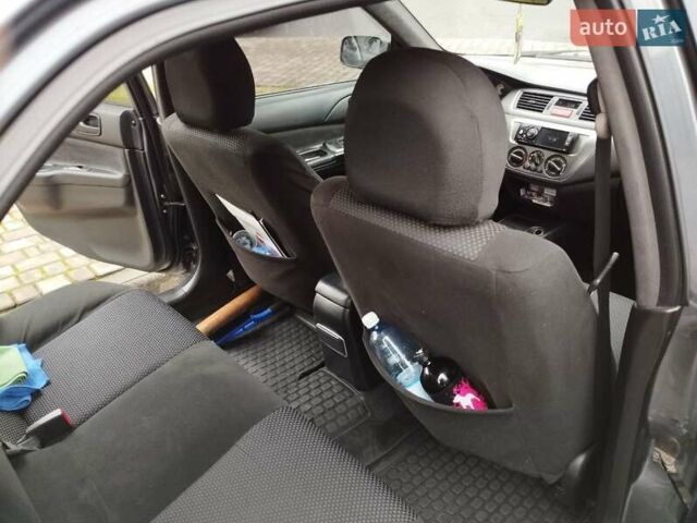 Сірий Міцубісі Lancer, об'ємом двигуна 1.58 л та пробігом 209 тис. км за 2900 $, фото 12 на Automoto.ua