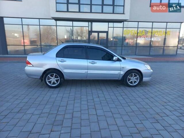 Серый Мицубиси Лансер, объемом двигателя 1.6 л и пробегом 228 тыс. км за 2999 $, фото 9 на Automoto.ua