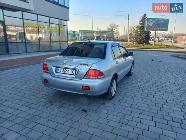 Серый Мицубиси Лансер, объемом двигателя 1.6 л и пробегом 228 тыс. км за 2950 $, фото 6 на Automoto.ua