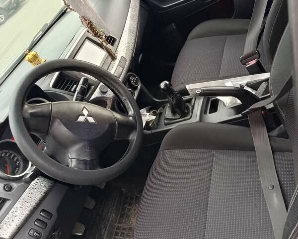 Серый Мицубиси Лансер, объемом двигателя 1.5 л и пробегом 304 тыс. км за 5200 $, фото 7 на Automoto.ua