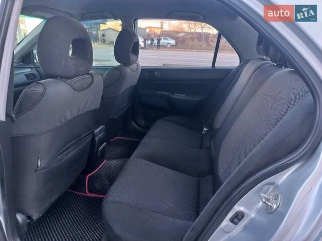 Серый Мицубиси Лансер, объемом двигателя 1.6 л и пробегом 228 тыс. км за 2999 $, фото 26 на Automoto.ua