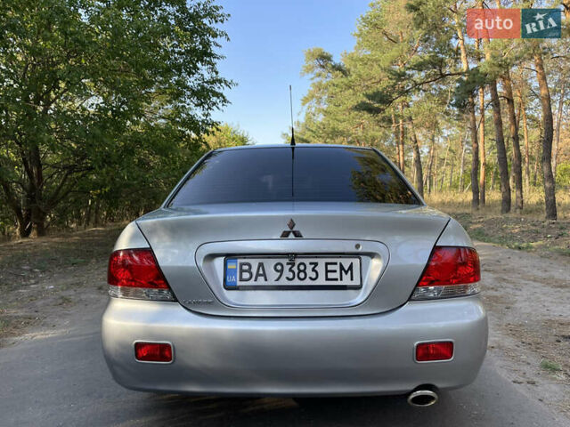 Серый Мицубиси Лансер, объемом двигателя 1.58 л и пробегом 232 тыс. км за 5600 $, фото 3 на Automoto.ua