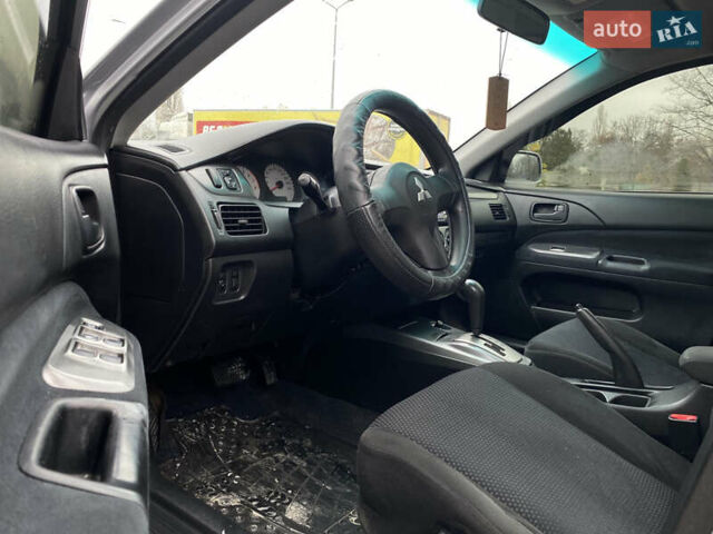 Сірий Міцубісі Lancer, об'ємом двигуна 1.58 л та пробігом 280 тис. км за 4650 $, фото 10 на Automoto.ua