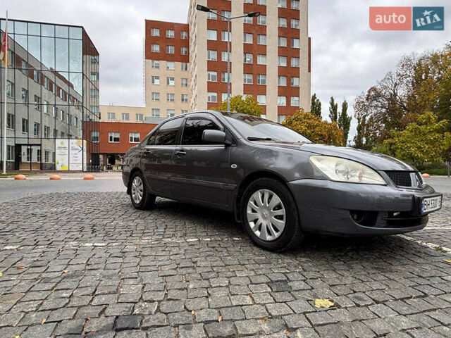 Серый Мицубиси Лансер, объемом двигателя 1.6 л и пробегом 218 тыс. км за 5100 $, фото 9 на Automoto.ua