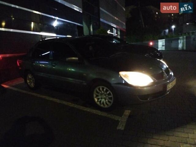 Сірий Міцубісі Lancer, об'ємом двигуна 1.58 л та пробігом 209 тис. км за 2900 $, фото 2 на Automoto.ua