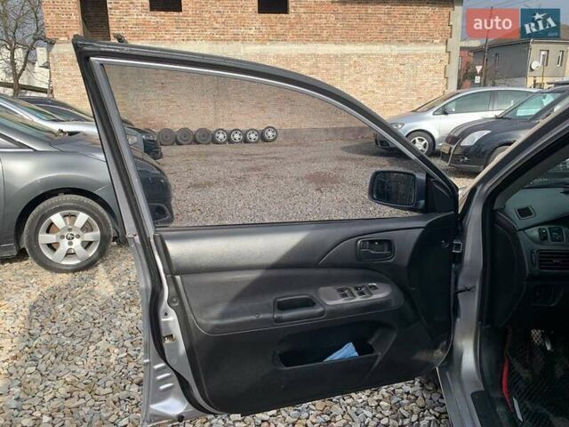 Серый Мицубиси Лансер, объемом двигателя 1.58 л и пробегом 227 тыс. км за 3599 $, фото 8 на Automoto.ua